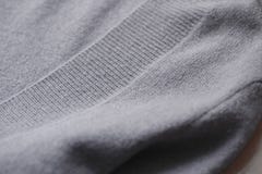 Beautiful, luxurious, knitted sweater in grey, autumn, winter, warm. royalty free stock photography Beautiful, luxurious, knitted sweater in grey, autumn, winter, warm. royalty free stock photography