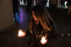 Model with black jacket in night photo with candles stock photo Model with black jacket in night photo with candles stock photo