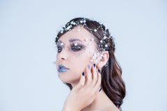 Beautiful model girl with blue manicure nail design,face and hair with beads, rhinestones ,decoration. Fashion makeup royalty free stock image Beautiful model girl with blue manicure nail design,face and hair with beads, rhinestones ,decoration. Fashion makeup royalty free stock image