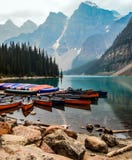 Mountain landscape with a lake and canoes royalty free stock photos Mountain landscape with a lake and canoes royalty free stock photos