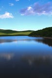 Beautiful lake with mirrored shine in soft mountains royalty free stock images Beautiful lake with mirrored shine in soft mountains royalty free stock images
