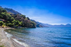 Beautiful outdoor view of shore at Lake Atitlan, during a gorgeous sunny day and blue water in Guatemala stock images Beautiful outdoor view of shore at Lake Atitlan, during a gorgeous sunny day and blue water in Guatemala stock images