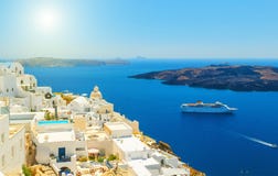 Beautiful panoramic view from touristic Fira town to caldera and volcano at summer sunny day. SantoriniThira island. Stock Photos Beautiful panoramic view from touristic Fira town to caldera and volcano at summer sunny day. SantoriniThira island. Stock Photos