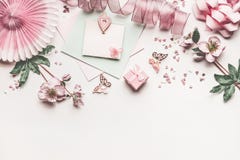 Beautiful Pastel Pink Layout With Flowers Decoration, Ribbon, Hearts, Bow And Card Mock Up On White Desk Background, Top View Stock Photos Beautiful Pastel Pink Layout With Flowers Decoration, Ribbon, Hearts, Bow And Card Mock Up On White Desk Background, Top View Stock Photos