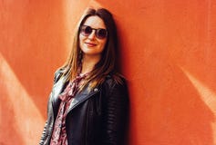 Beautiful portrait of brunette woman against wall in sunny day royalty free stock photography Beautiful portrait of brunette woman against wall in sunny day royalty free stock photography