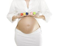 Beautiful Pregnant Woman Holding Baby Blocks Stock Photography