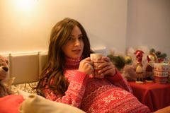 Beautiful pregnant young woman on a Christmas, having a rest on Christmas holidays before the new year. Big pregnant royalty free stock photography Beautiful pregnant young woman on a Christmas, having a rest on Christmas holidays before the new year. Big pregnant royalty free stock photography
