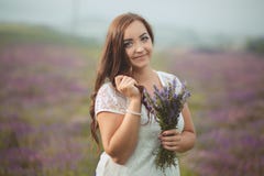 Beautiful provence woman relaxing in lavender field watching on sunset holding basket with lavanda flowers. Series. alluring girl Royalty Free Stock Photo Beautiful provence woman relaxing in lavender field watching on sunset holding basket with lavanda flowers. Series. alluring girl Royalty Free Stock Photo