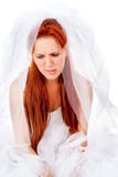 A beautiful red-haired bride cries