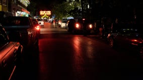 Beautiful red light from the car`s rear lights reflects off the surface stock images Beautiful red light from the car`s rear lights reflects off the surface stock images