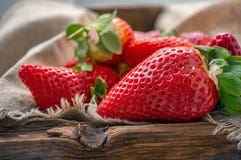 Beautiful ripe strawberries for sale on a tray in wooden containers. without plastic stock images Beautiful ripe strawberries for sale on a tray in wooden containers. without plastic stock images