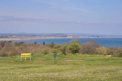 Beautiful scenic aerial-like bright view of golf course with social distancing boards, Irish sea, beach and Dublin bay