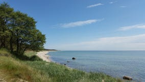 Beautiful scenic sandy beach, blue water, clear blue sky, Island Bornholm Denmark Royalty Free Stock Photos Beautiful scenic sandy beach, blue water, clear blue sky, Island Bornholm Denmark Royalty Free Stock Photos