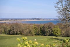 Beautiful scenic bright view of Dublin Bay with old trees and golf course seen from Howth, Dublin, Ireland