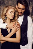 Beautiful Sensual Couple In Elegant Clothes Posing In Studio Royalty Free Stock Image