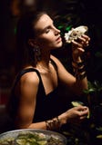 Beautiful fashion brunette woman in expensive interior restaurant eat oysters royalty free stock photography Beautiful fashion brunette woman in expensive interior restaurant eat oysters royalty free stock photography