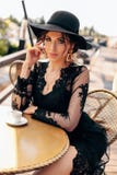 Beautiful Sexy Woman With Dark Hair In Elegant Black Dress And Hat Royalty Free Stock Image Beautiful Sexy Woman With Dark Hair In Elegant Black Dress And Hat Royalty Free Stock Image