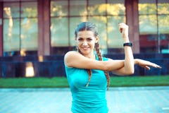 Content sportswoman stretching on street stock images Content sportswoman stretching on street stock images