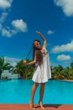 Beautiful Slim Girl Having Fun Near The Warm Blue Water With Palm Trees On Background. Royalty Free Stock Photo Beautiful Slim Girl Having Fun Near The Warm Blue Water With Palm Trees On Background. Royalty Free Stock Photo
