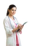 Beautiful smiling woman doctor hold pen filling patient history list at clipboard pad. Healthy lifestyle concept stock image Beautiful smiling woman doctor hold pen filling patient history list at clipboard pad. Healthy lifestyle concept stock image