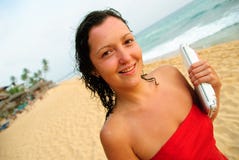 Beautiful Smiling Young Woman With Laptop On Beach Stock Photos