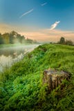 A beautiful sunrise over a misty meadow and a river Royalty Free Stock Photos A beautiful sunrise over a misty meadow and a river Royalty Free Stock Photos
