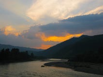 Beautiful sunset on the river with mountains stock images Beautiful sunset on the river with mountains stock images