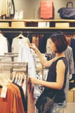 Beautiful Thai woman Asia girl shopping shirts royalty free stock photography Beautiful Thai woman Asia girl shopping shirts royalty free stock photography