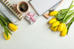 Beautiful tulips, copybooks, present and cup of coffee royalty free stock photo Beautiful tulips, copybooks, present and cup of coffee royalty free stock photo