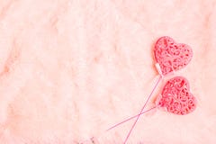 Beautiful two pink hearts on sticks on light fur background with copy space royalty free stock image Beautiful two pink hearts on sticks on light fur background with copy space royalty free stock image