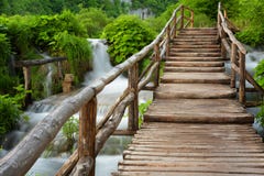 Beautiful View Of Waterfalls With Turquoise Water And Wooden Pathway Through Over Water. Plitvice Lakes National Park, Croatia. Fa Royalty Free Stock Photography