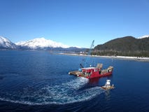 Tugboat escorting Alaskan work boat into harbor royalty free stock photos Tugboat escorting Alaskan work boat into harbor royalty free stock photos