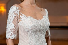 Beautiful white wedding dress with embroidery close-up shot stock image Beautiful white wedding dress with embroidery close-up shot stock image