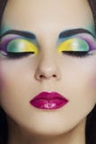 Beautiful woman with colourful makeup