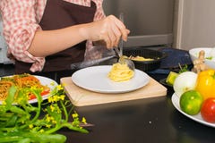 Beautiful woman cooking in new kitchen making healthy food with Stock Photos Beautiful woman cooking in new kitchen making healthy food with Stock Photos