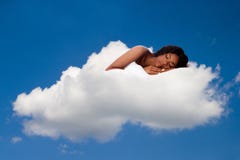 Beautiful woman deeply asleep and dreaming on Cloud nine Stock Photography Beautiful woman deeply asleep and dreaming on Cloud nine Stock Photography