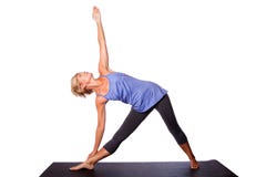 Beautiful woman doing Triangle yoga pose