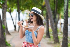 https://thumbs.dreamstime.com/t/beautiful-woman-eating-asian-street-food-walking-park-seaside-young-girl-tourist-try-exotic-meal-vacation-beautiful-100492713.jpg