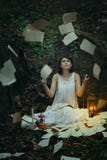 Beautiful woman with flying pages and books royalty free stock photography Beautiful woman with flying pages and books royalty free stock photography