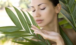 Beautiful woman holding aloe vera gel, skin care and wellness. F royalty free stock photography Beautiful woman holding aloe vera gel, skin care and wellness. F royalty free stock photography