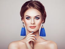 Beautiful Woman with Large Earrings Tassels royalty free stock photo Beautiful Woman with Large Earrings Tassels royalty free stock photo