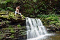 Beautiful woman outdoors - next to waterfall royalty free stock images Beautiful woman outdoors - next to waterfall royalty free stock images