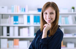 Beautiful woman posing in the office royalty free stock image Beautiful woman posing in the office royalty free stock image