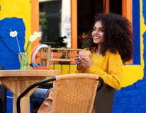 https://thumbs.dreamstime.com/t/beautiful-woman-smiling-cup-coffee-portrait-african-american-outdoor-cafe-72302833.jpg