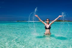 Beautiful woman splashing in the sea royalty free stock photography Beautiful woman splashing in the sea royalty free stock photography