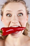 Beautiful Woman Teeth Eating Red Hot Chili Pepper Royalty Free Stock Image
