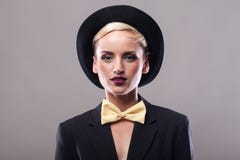 Beautiful woman wearing hat on gray background stock photos Beautiful woman wearing hat on gray background stock photos