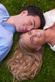Beautiful Young Couple Cheek To Cheek In Grass Royalty Free Stock Photos