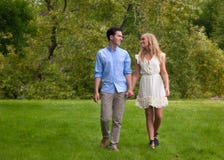 Beautiful Young Couple Walking In The Park Royalty Free Stock Photo