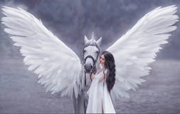 Beautiful, young elf, walking with a unicorn. She is wearing an incredible light, white dress. Art hotography